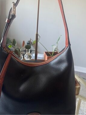Black leather Dooney & Bourke hobo bag autism awareness, edition